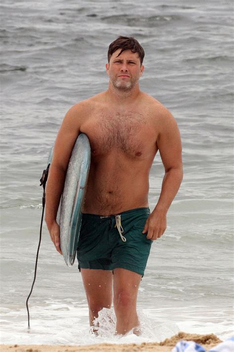 Colin Jost spotted surfing shirtless in the Hamptons